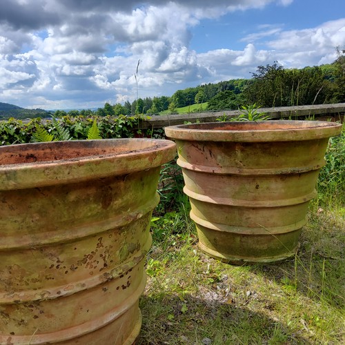 57 - An impressive pair of substantial terracotta country house estate planters 53cms high x 67.5cms dia.