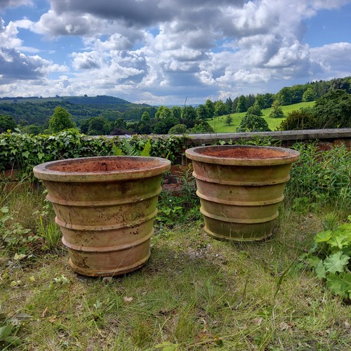 57 - An impressive pair of substantial terracotta country house estate planters 53cms high x 67.5cms dia.