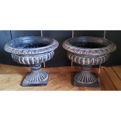 62 - A pair of Victorian style fibreglass pedestal urns, black with terracotta highlights, suitable for o... 