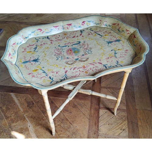 64 - A contemporary decorative Papier-mâché style tray table, the ray decorated with red, gr... 