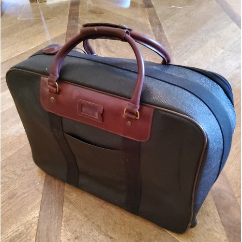 91 - A genuine Mulberry suitcase on casters55cm wide x 43cm high, tartan interior