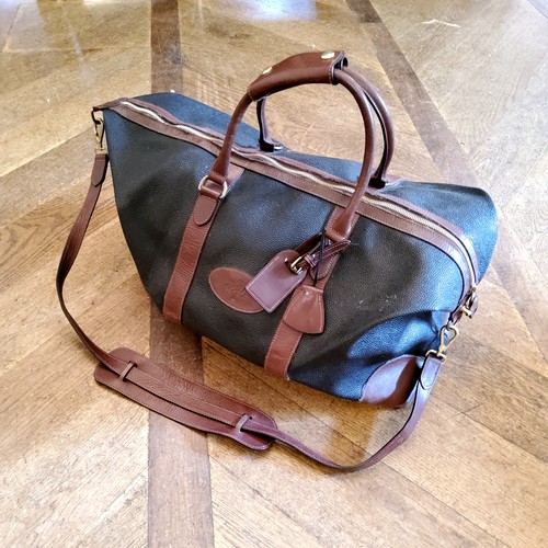 92 - A genuine Mulberry Clipper holdall / weekend bag, large in size, bearing Serial No. 343252, monogram... 