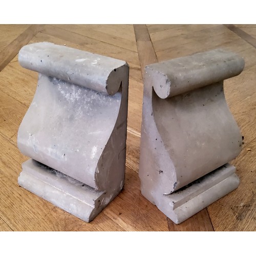 123 - A pair of reconstituted scrolling ogee corbels, useful as bookends, polished concrete, standing 23cm... 