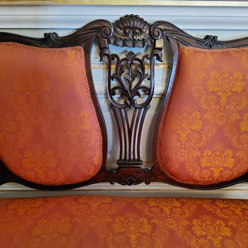 125 - An Edwardian 'Hepplewhite' two seater salon sofa upholstered in rich terracotta and gold tones c.190... 