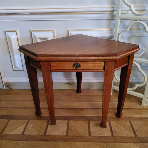 126 - An unusual late Victorian mahogany canted corner table with single drawer to frieze raised on taperi... 