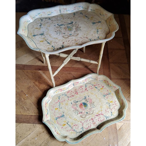 133 - A contemporary decorative Papier-mâché style tray table, the ray decorated with red, gr... 