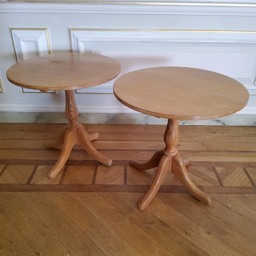 135 - Pair of limed oak circular tavern tables, dia 71cm x 70cm high