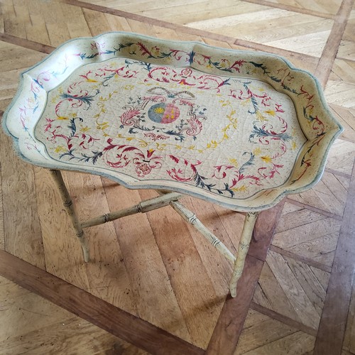 155 - A contemporary decorative Papier-mâché style tray table, the ray decorated with red, gr... 