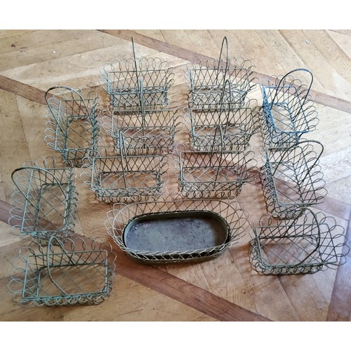 169 - Twelve centrepiece wirework baskets, green; an oval wirework planter (13)