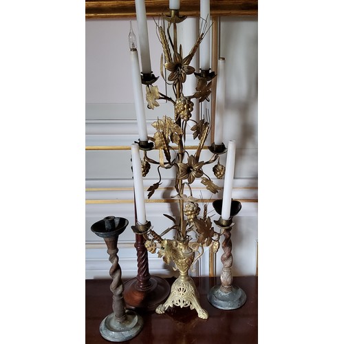 172 - An ornate French gilt metal six light candelabra, a two handled urn holding a central post decorated... 