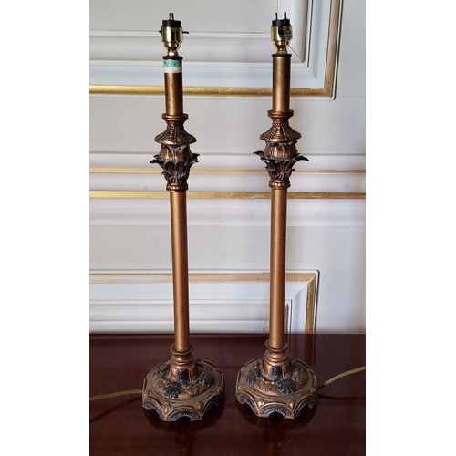 213 - A pair of contemporary ornate metal and resin lamp bases in tones of gold & black 57cms high (PA... 