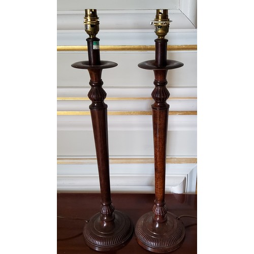 217 - A pair of metal lamps in the form of Regency style candlesticks with 'burr walnut' finish, the base ... 