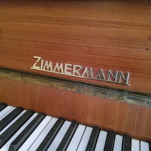 220 - A Zimmerman upright piano, piano stool and music stand (used during wedding celebrations) currently ... 