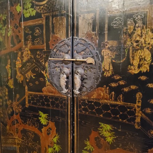 3 - An 18th century style Chinese black lacquered marriage chest, decorated with pseudo-Oriental temple ... 