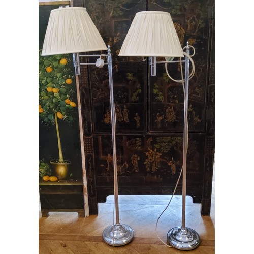 227 - A pair of modern chromed swing arm reading lamps. PAT TESTED.