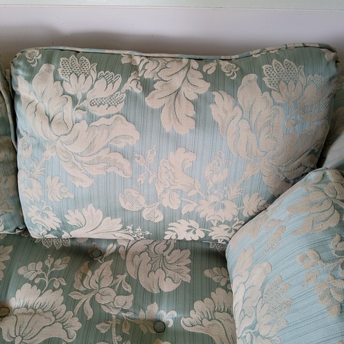 238 - A small country house two seater 'loving seat' sofa with bold floral damask upholstery in tones of s... 