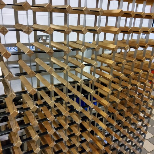 247 - Two 120 bottle wine racks, classic design of wood and steel construction (240 bottle capacity), some... 