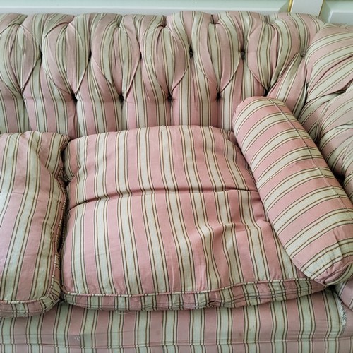 274 - A Victorian deep button backed Chesterfield type country house sofa, traditional pink pin-striped Fr... 