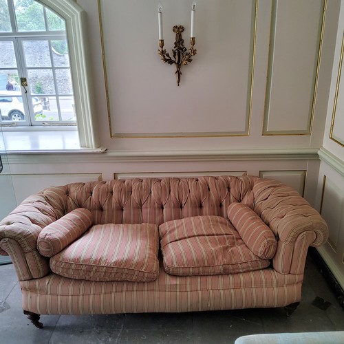 274 - A Victorian deep button backed Chesterfield type country house sofa, traditional pink pin-striped Fr... 