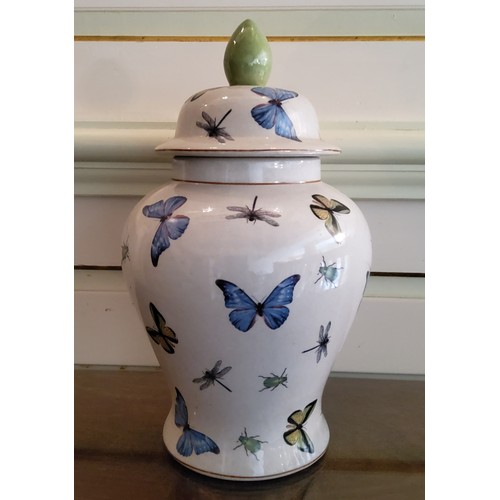 74 - A large baluster shaped jar & cover, decorated with butterflies, dragonflies & beetles on li... 