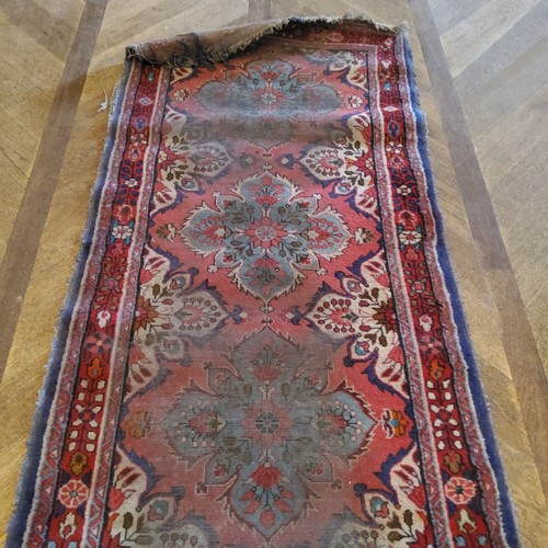 280 - A hand knotted Persian Sarab runner, in tones of turquoise and rich reds, 411cm long x 90cm