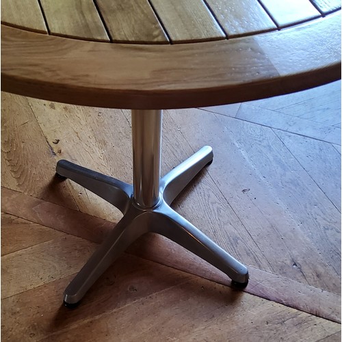 250 - An oak & aluminium garden table, quadruped base 60cms dia. x 70cms high