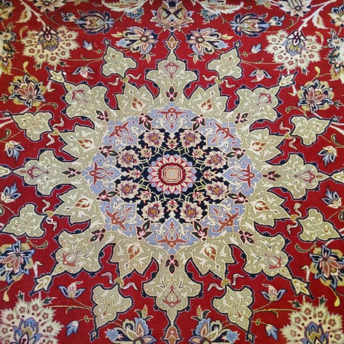 281 - A substantial Persian Najafabad carpet, the red ground carpet with large central medallion motif sur... 