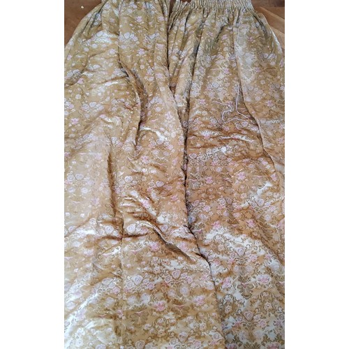 267 - A pair of heavy embroidered silk pencil pleat curtains in tones of gold & pink on a gold ground,... 