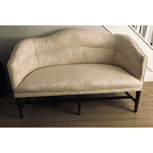 126A - A George III two seater sofa, cream damask fabric, h-stretcher tapering mahogany legs