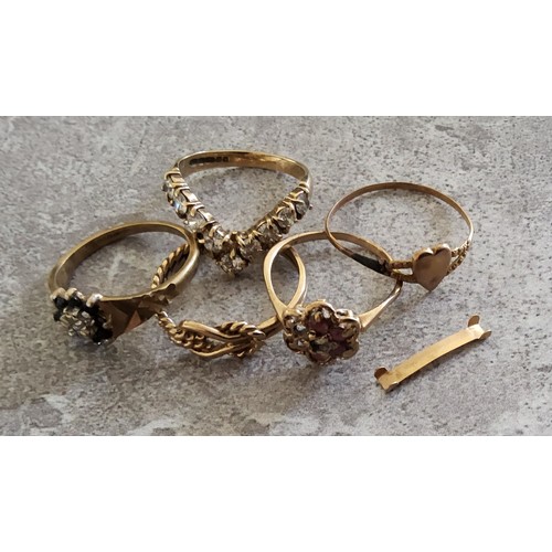 34 - A 9ct gold wishbone ring claw set with nine round white stones, 2.36g; a 9ct gold knot ring 1.78g; a... 