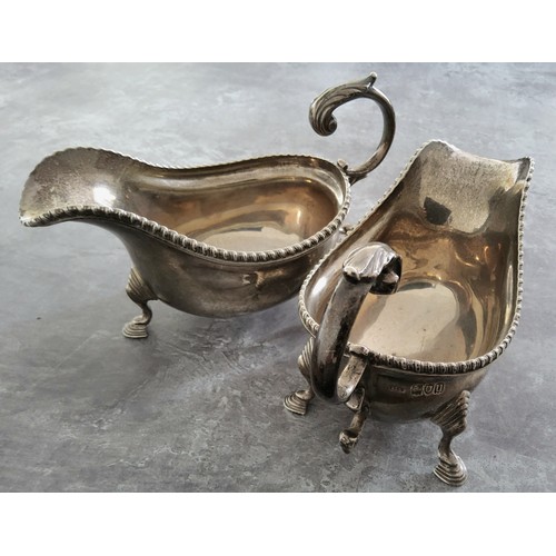 69 - A pair of Edwardian sauce boats, gadrooned borders, acanthus-capped scroll handle, hoof feet, 1... 