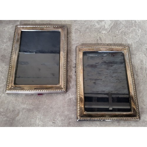 70 - A pair of silver photograph frames, 16 x 12cms, Ron Carr, Sheffield, 1988