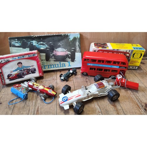 247 - A 1960's boxed Bandai R/C 7-7579remote control Lotus F1 car, red tinplate body, Japanese market box;... 