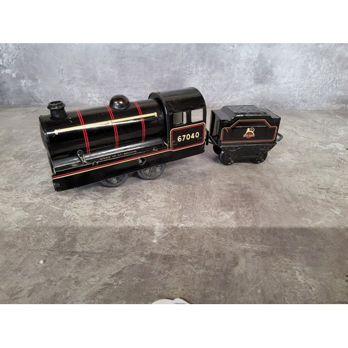 241A - A Brimtoy O gauge clockwork 040 locomotive no 67040, black with red & cream lines, appears unuse... 