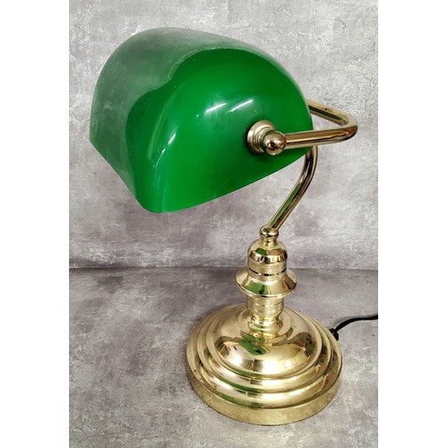 11 - A library desk reading lamp, swivel green shade on a turned brass weighted base