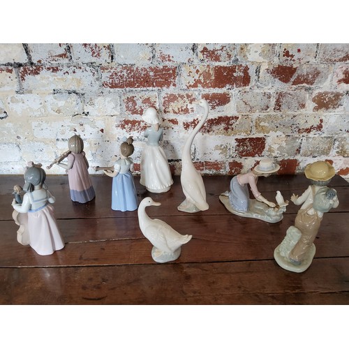 23 - NAO by Lladro figures including a long necked goose; another smaller; Mandolin player, Violinist &am... 