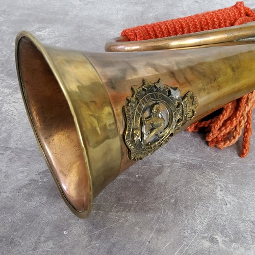 50 - Militaria - A WWI copper and brass bugle with Ontario Regiment badge of a cat with arched back withi... 