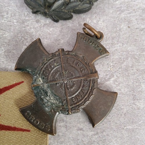 54 - Militaria - a German political cap eagle by Ferdinand Wagner of Pforzheim and marked RZM M1/8; a WWI... 