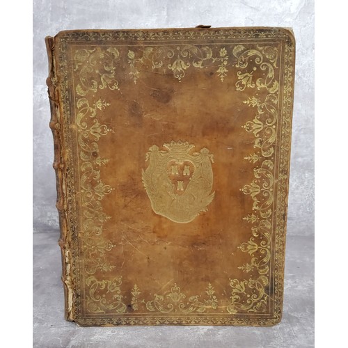 61 - An unusual early 18th century French decorative leather bound book with hidden compartment made out ... 