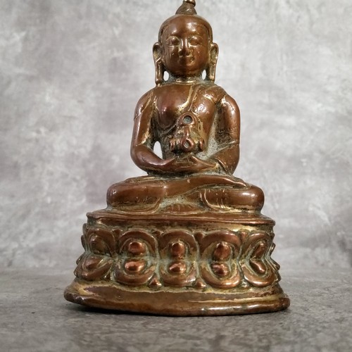 69 - A very early Chinese shrine bronze deity showing signs of gilt 10cm high