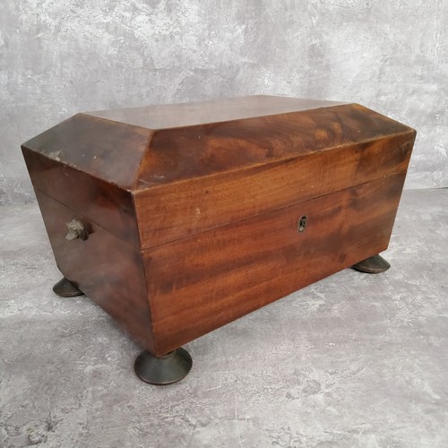 73 - A Regency rosewood tea caddy c.1820; a George III walnut sarcophagus shaped tea caddy raised in bun ... 