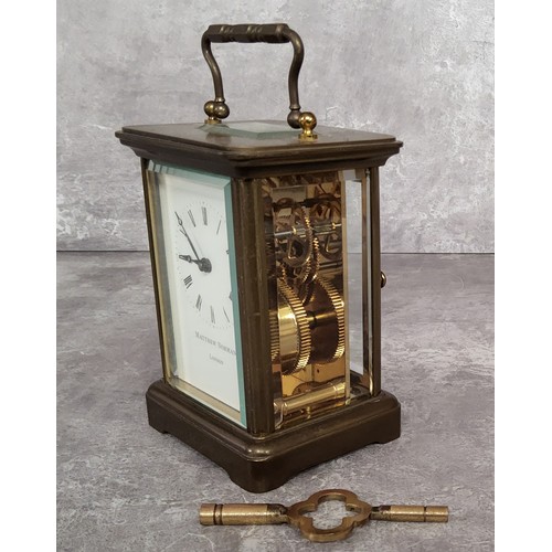 86 - A contemporary brass cased Matthew Norman, London carriage clock, white enamel dial black Roman nume... 