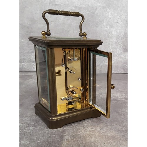 86 - A contemporary brass cased Matthew Norman, London carriage clock, white enamel dial black Roman nume... 