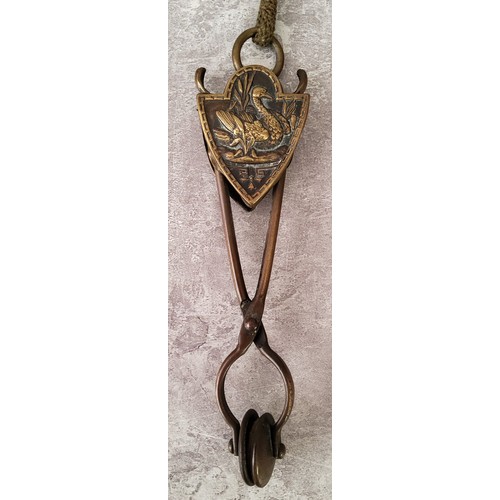 88 - A Victorian Eyre's Patent brass skirt lifter of scissor form, the heraldic shield shaped sliding bos... 