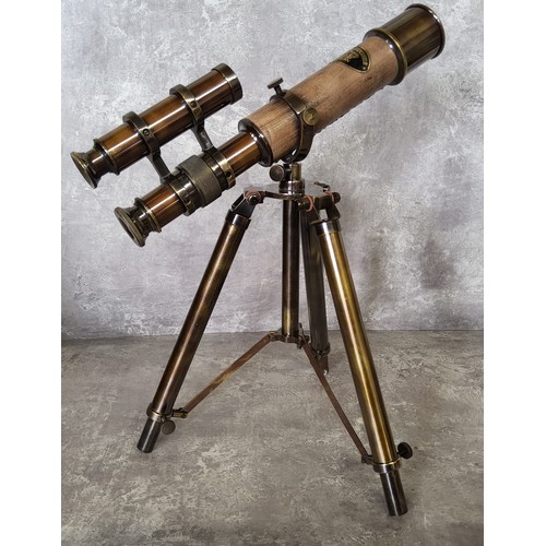 92 - A bronzed brass novelty double barrel nautical desk telescope on tripod stand 31cms high