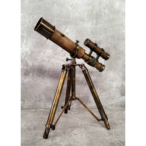 92 - A bronzed brass novelty double barrel nautical desk telescope on tripod stand 31cms high