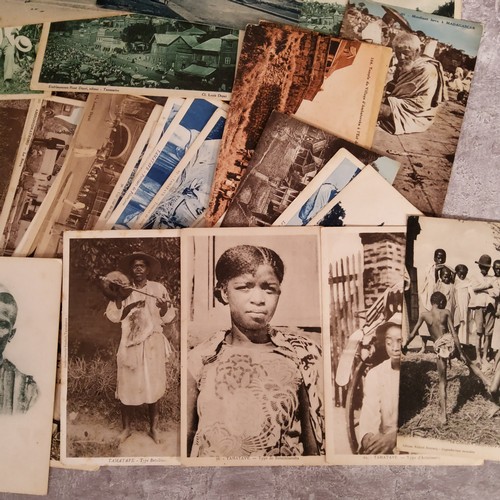 103 - A collection of early 20th century French Madagascar postcards showing colonial scenes, tribesmen, e... 