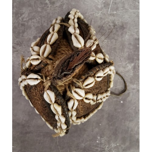 106 - Tribal Art - A 19th century African cowrie shells embellished crown or 