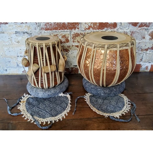 112 - A Tabla set of two Indian drums, consisting of larger Daya and smaller Baya drum, housed in travelli... 