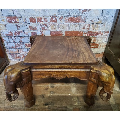 115 - Tribal - A 20th century tribal occasional table with ornately carved legs depicting elephants.Height... 